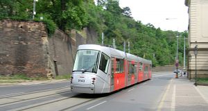 "Porsche tram" (Škoda 14 T) is running on Edvard Beneš quay (Nábřeží Edvarda Beneše).