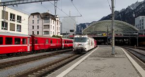 The advertising locomotive Ge 4/4 III 623 hauls her Regio Express to St. Moritz.