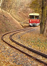Approximately 1 km above Márianosztra, the first train in the morning, the brand new motor car 8444 001 is descending from Nagyirtás.