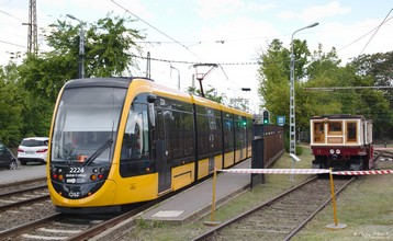 The oldest metro car with one of the newest trams, the 34 m long CAF Urbos 3